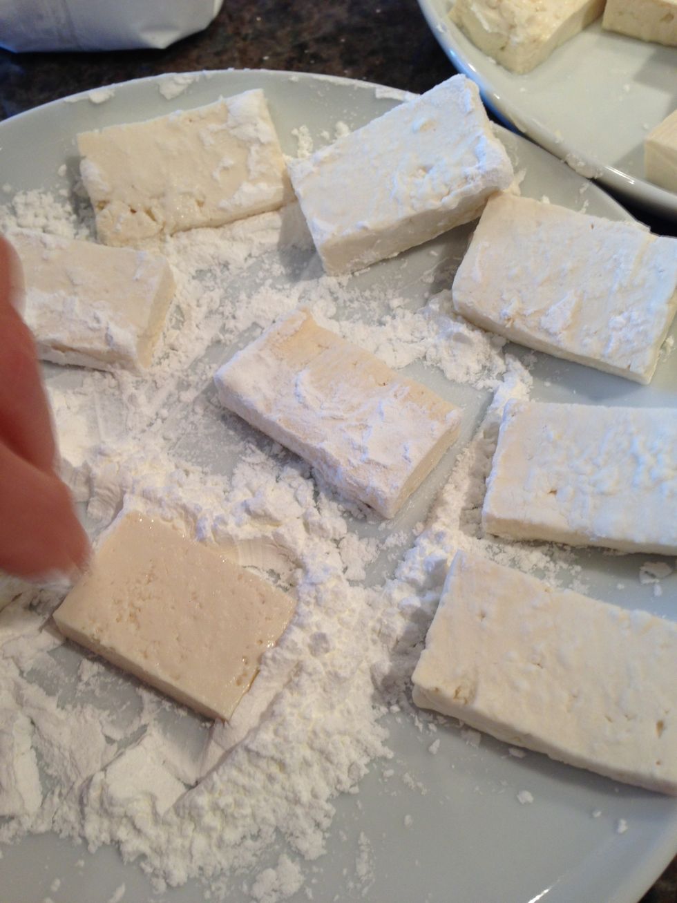 Cover tofu pieces in corn starch
