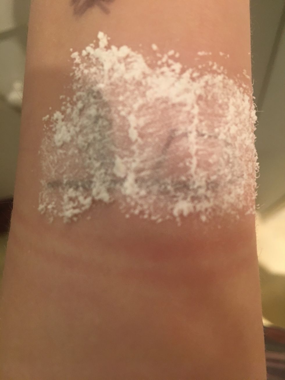 Cover where you drew with your corn starch or baby powder then wipe it off with a cotton ball or tissue.
