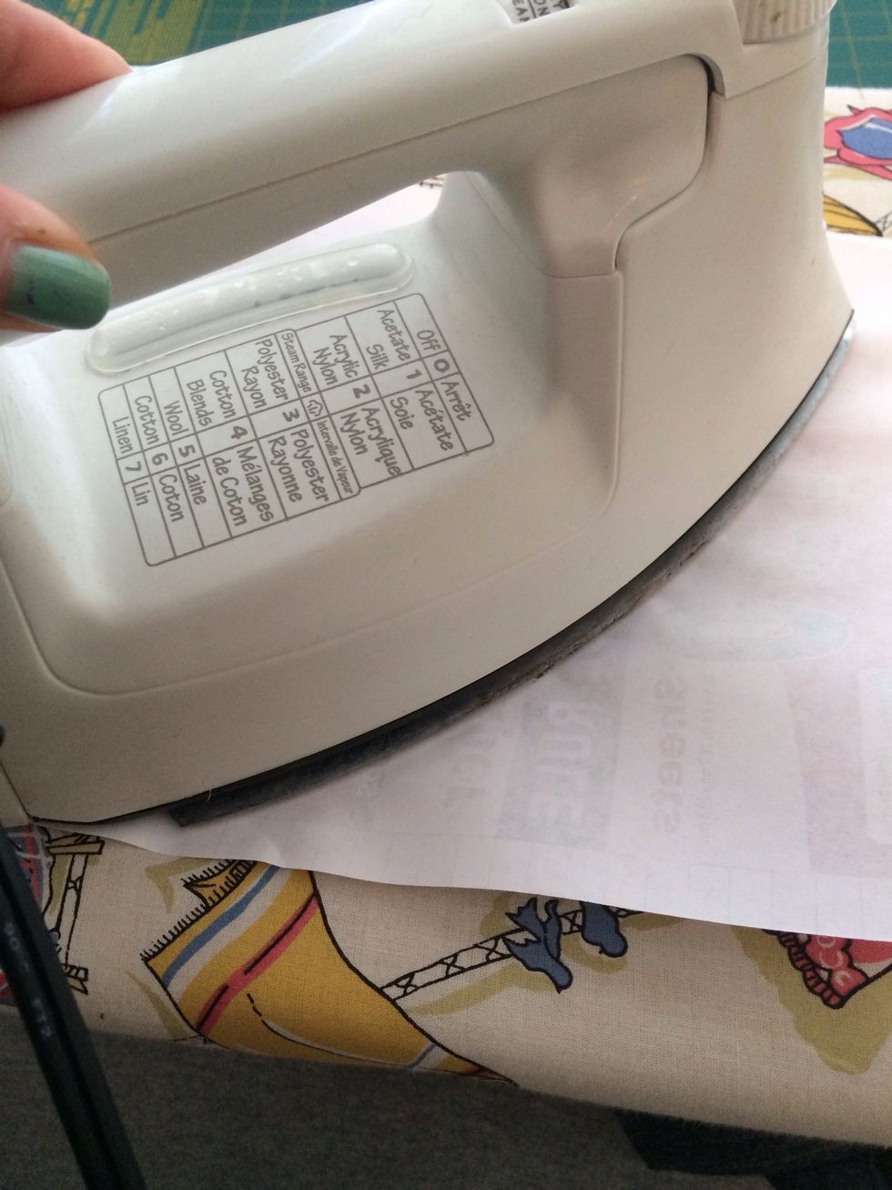 Cover with a sheet of paper and iron.