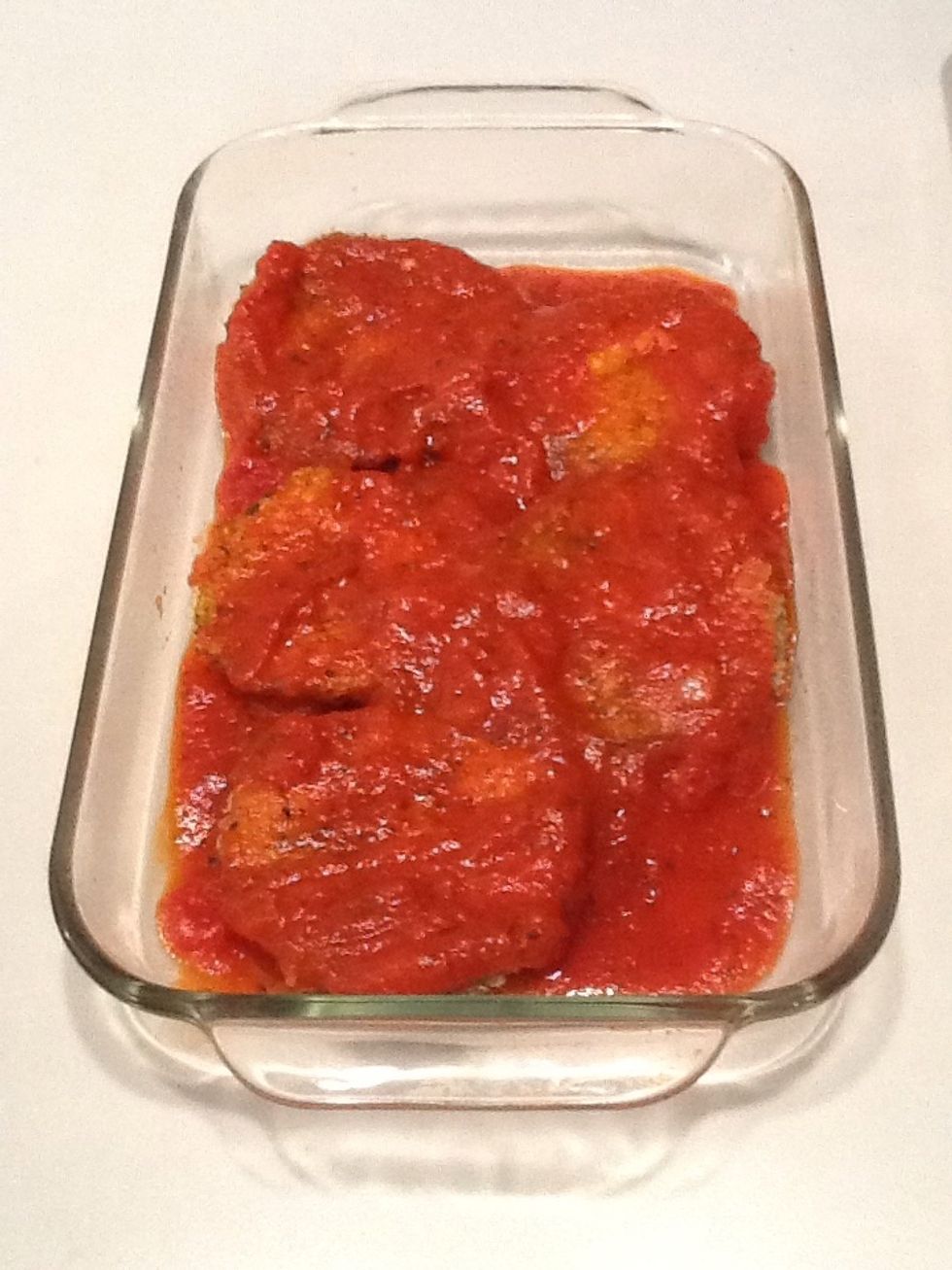 Cover with another cup of spaghetti sauce.