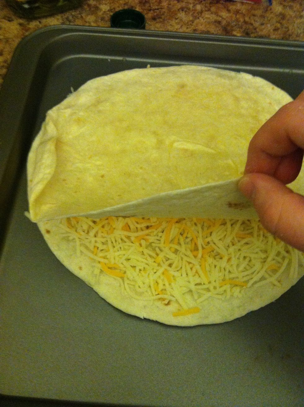 Cover with another tortilla, (olive oil on top )