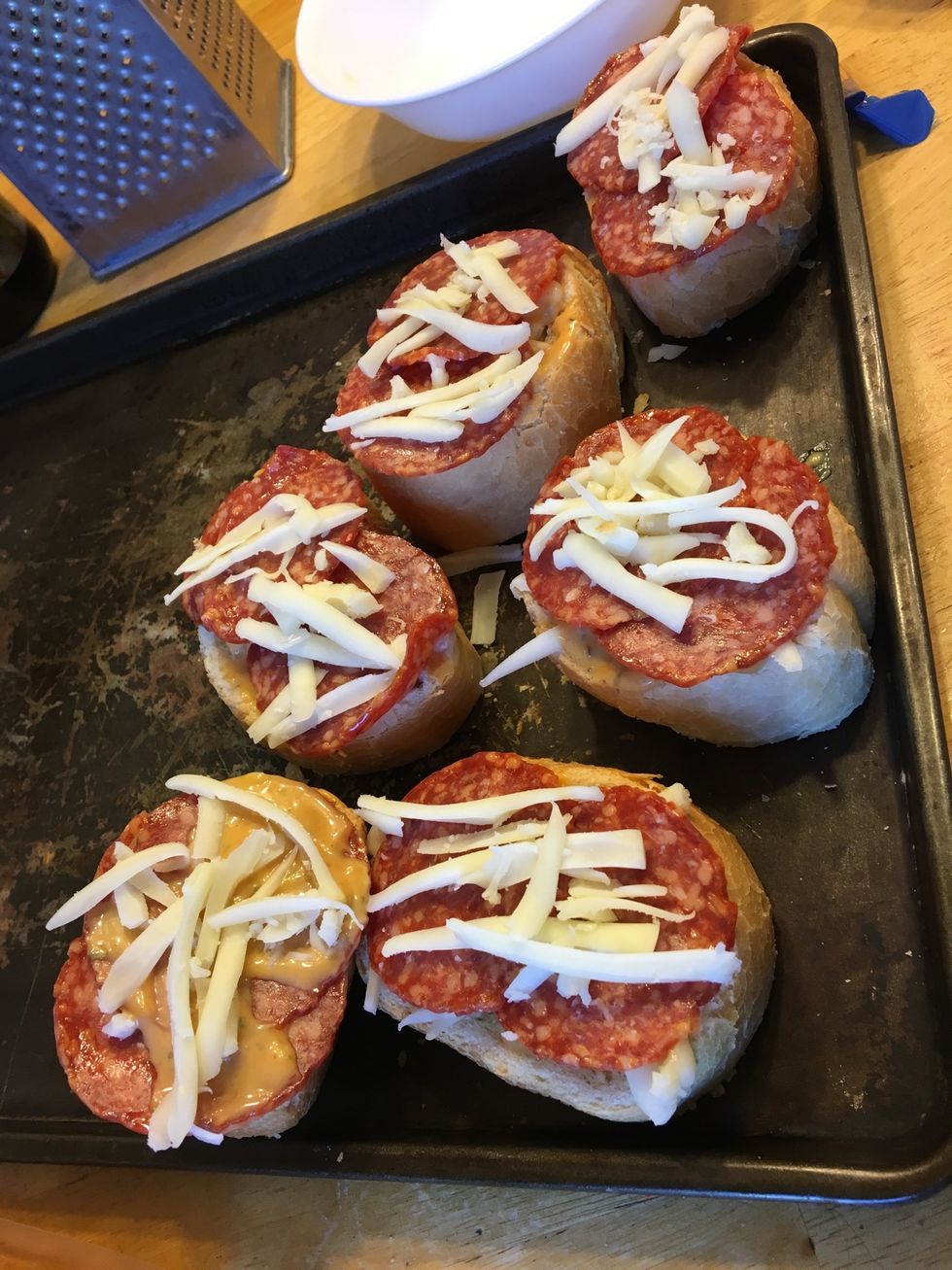 Cover with cheese then sauce and continue steps until sauce runs out.