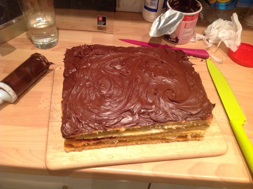 Cover with chocolate fudge buttercream icing (I used shop bought to make it easier but you can use any kind of buttercream or ganache)