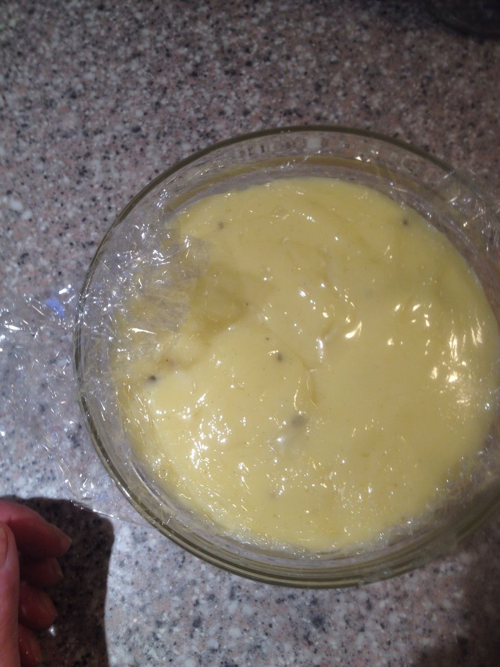 Cover with cling film, to prevent skin. Cool it down and keep it in the fridge until you need it. It will keep in the fridge for a week.