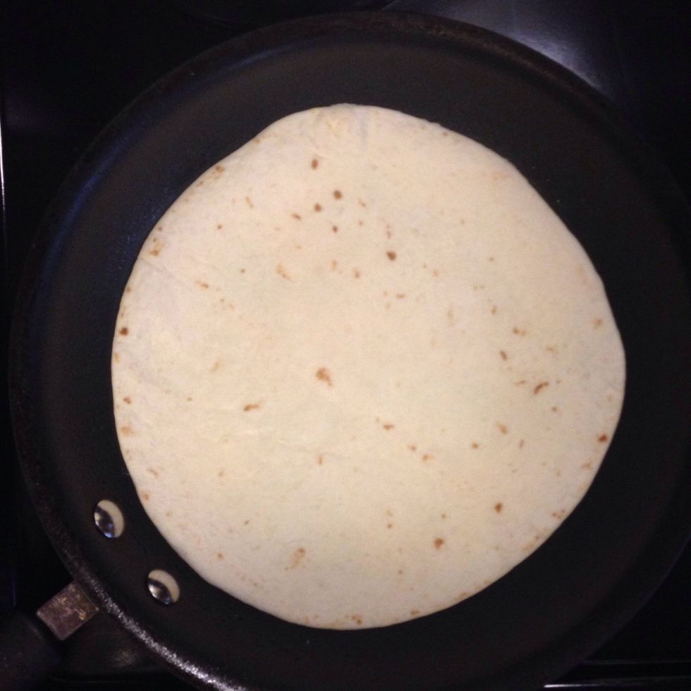 Cover with flour burrito shell (Sub taco shell for smaller portions). Allow eggs to set slightly