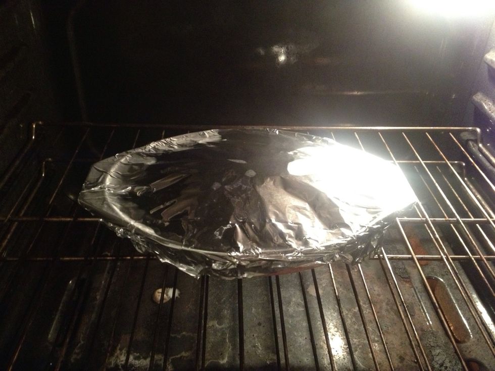 Cover with foil and place into 400\u2022 pre-heated oven for 25 mins. Remove foil and allow to brown for 15 additional minutes.