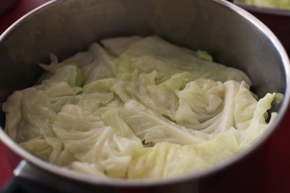 Cover with more small or hard pieces of cabbage