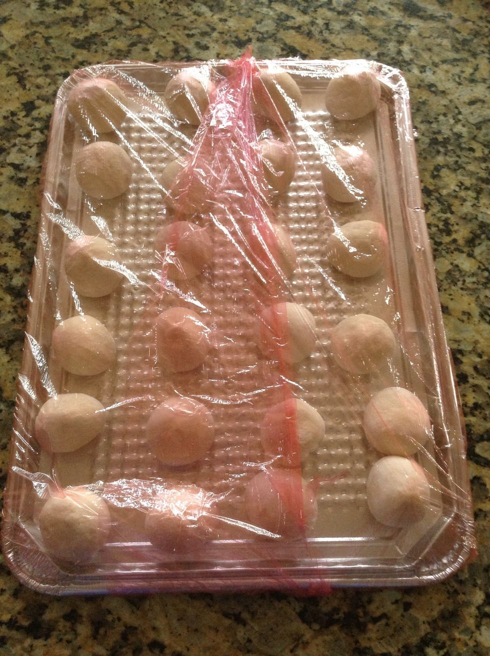 Cover with plastic wrap and let raise somewhere warm. Make sure they don't over proof! Only let them raise enough that they aren't cold all thru the dough