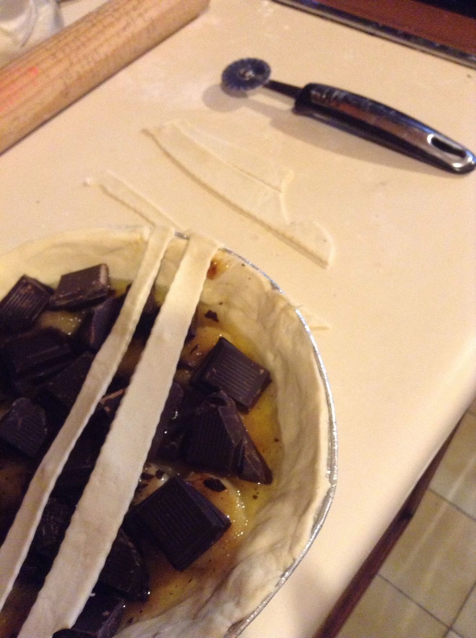 Cover with some strips of the puff paste