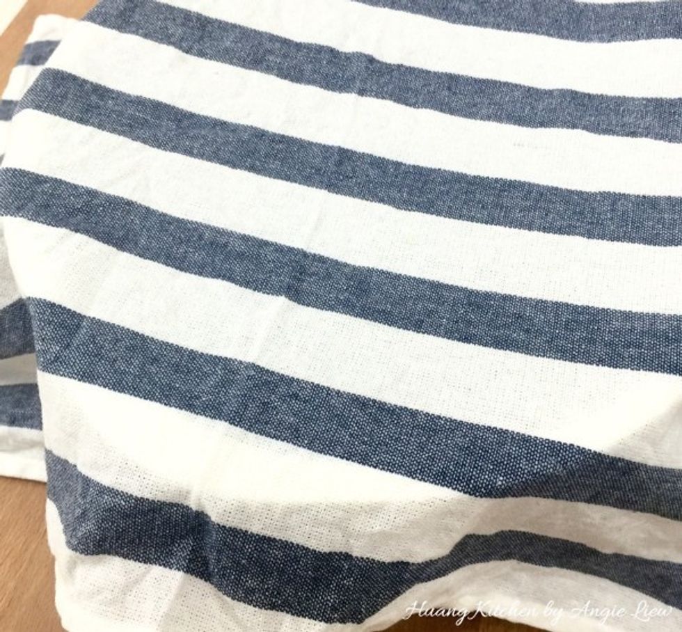 Cover with the damp towel and allow the dough to rest for another 15 minutes.