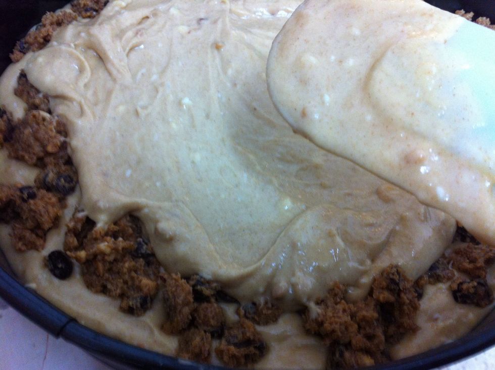 Cover with the rest of the base mixture abd sprinkle all the rest of the topping