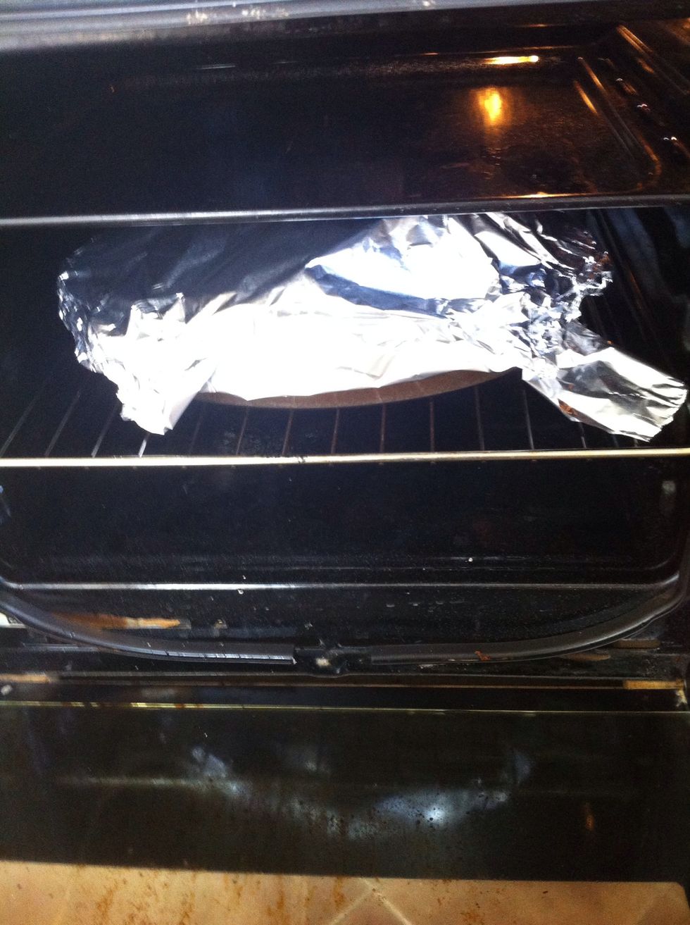 cover with tin foil and put in oven