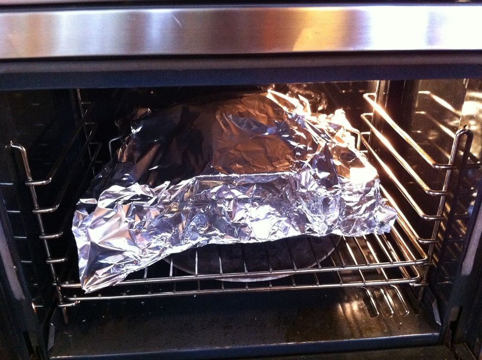 Cover your bird with aluminum foil (to prevent overcooking the skin) and place in the oven at 325 degrees.