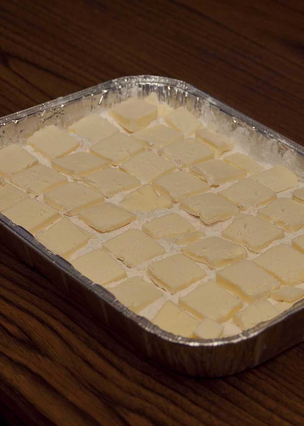 Cover your cake mix with the slices of butter.