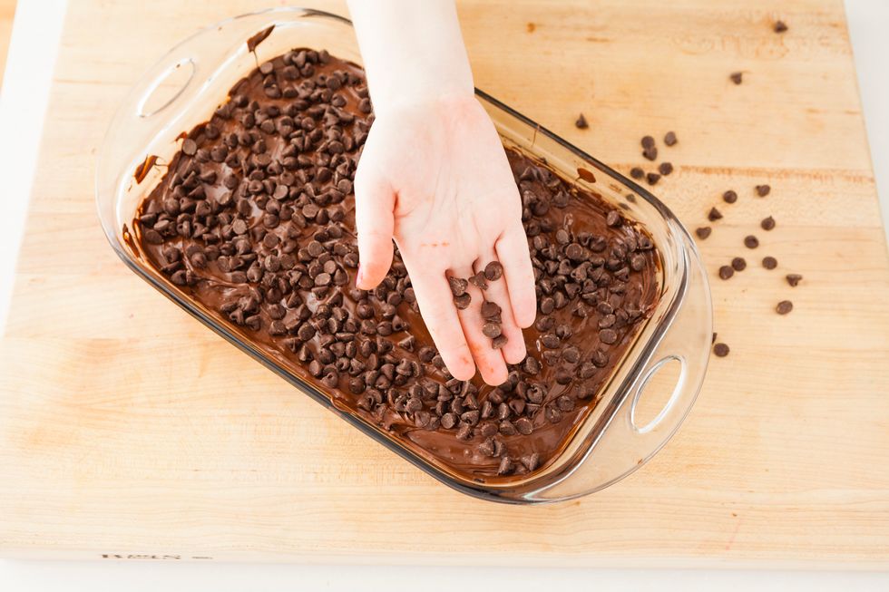 Cover your melted chocolate layer with more chocolate chips.