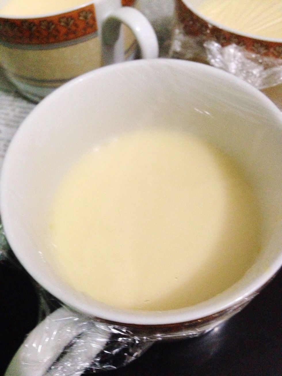 Cover your ramekin with alumunium foil. I'm using microwave-safe plastic wrap because I run out of foil. the foil will prevent the surface of pudding from getting dry