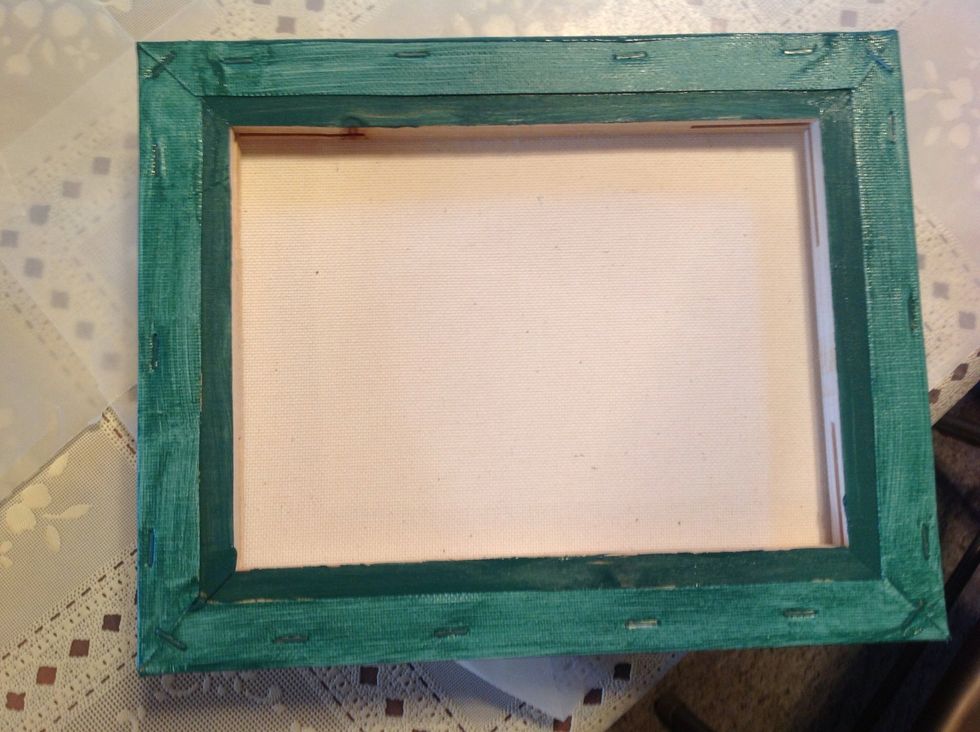 Cover your work space with wax paper, or something similar. Paint the back of your canvas.