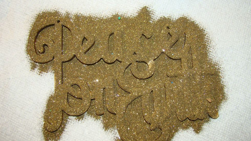 Covereed with gold embossing powder and heat set.