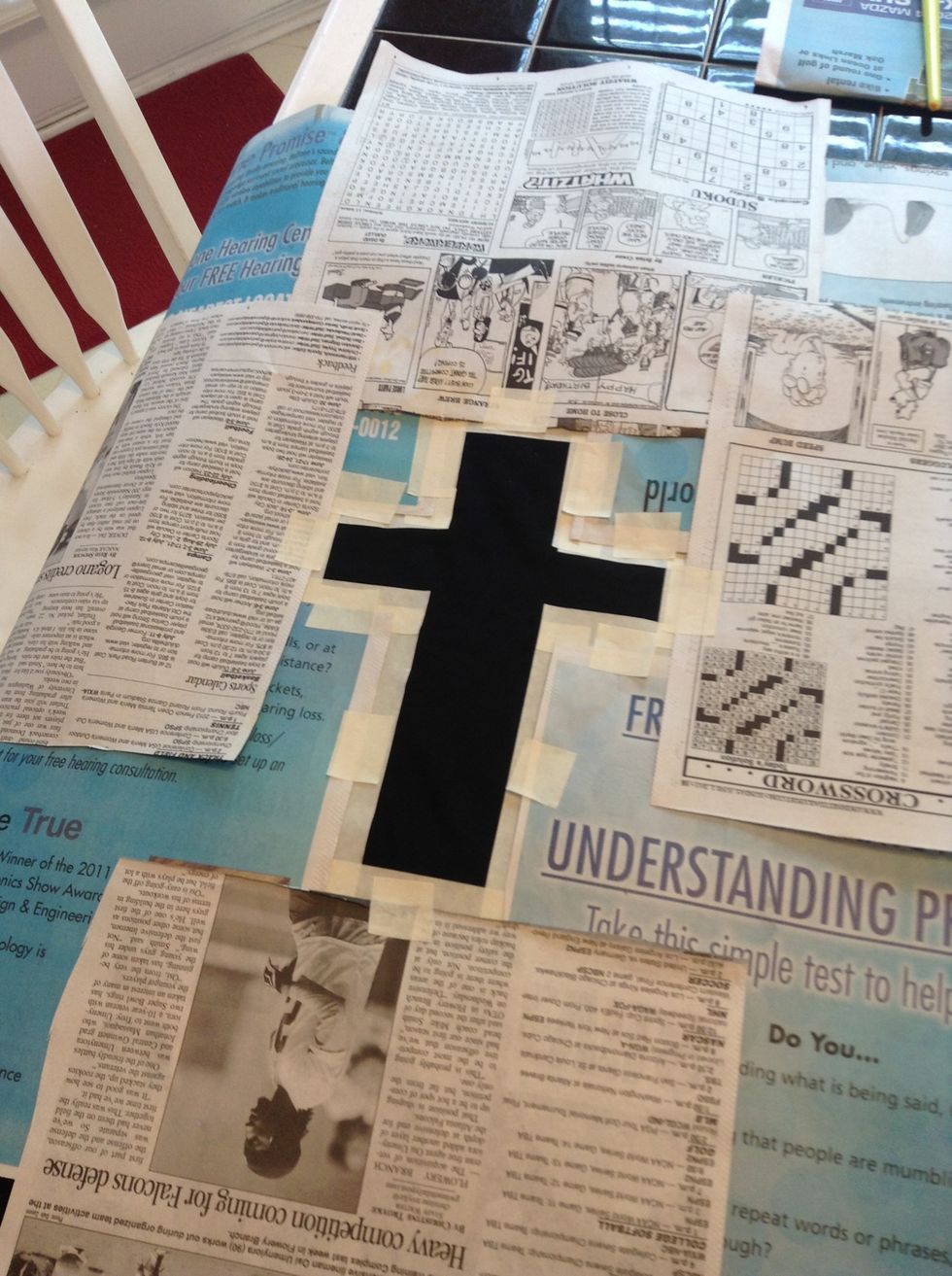 covering the rest of the shirt with newspaper