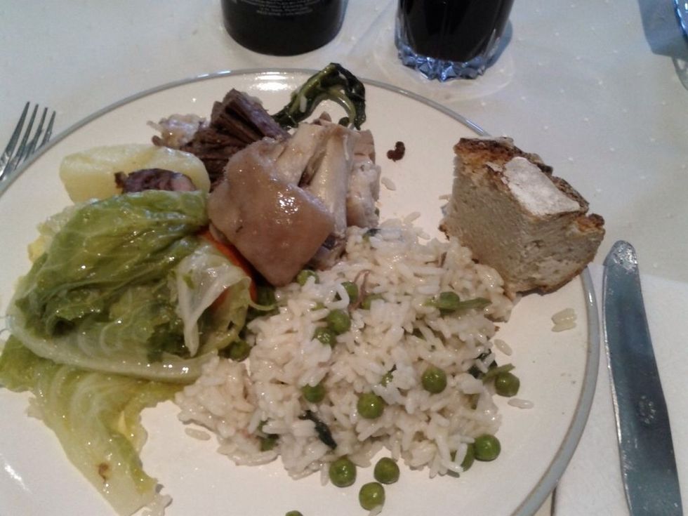 Cozido served with rice and peas.