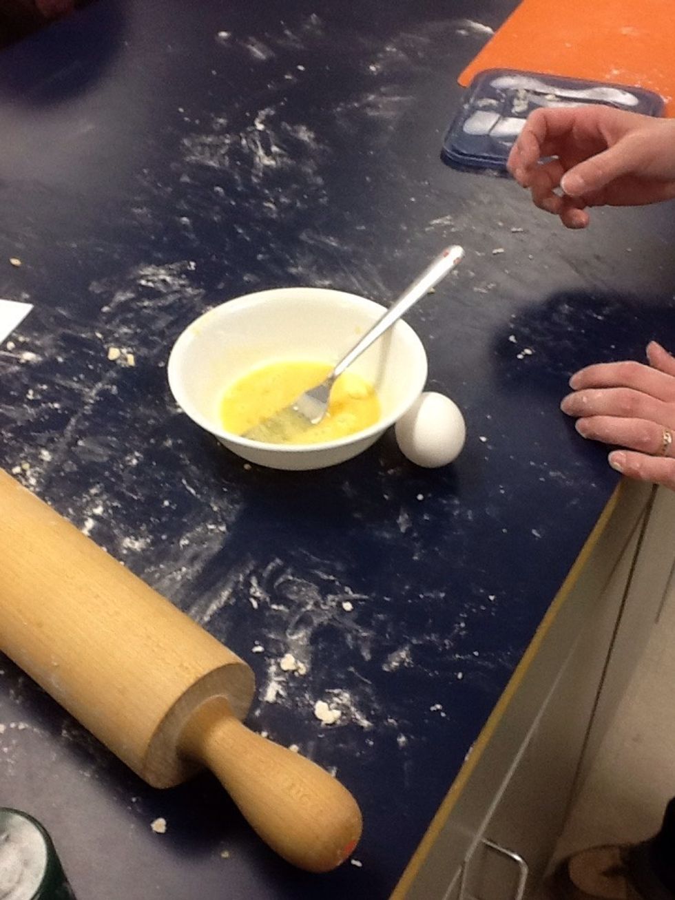 Crack 1 egg into a side bowl, beat with fork