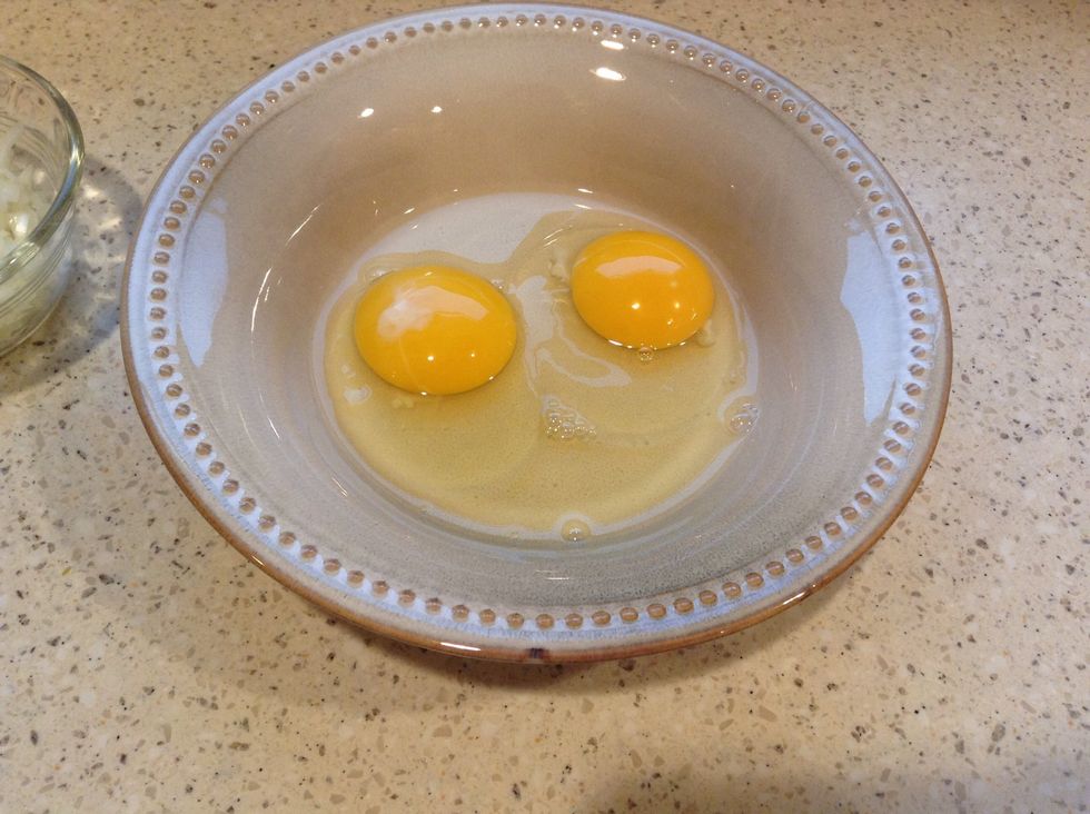 Crack 2 eggs and set aside