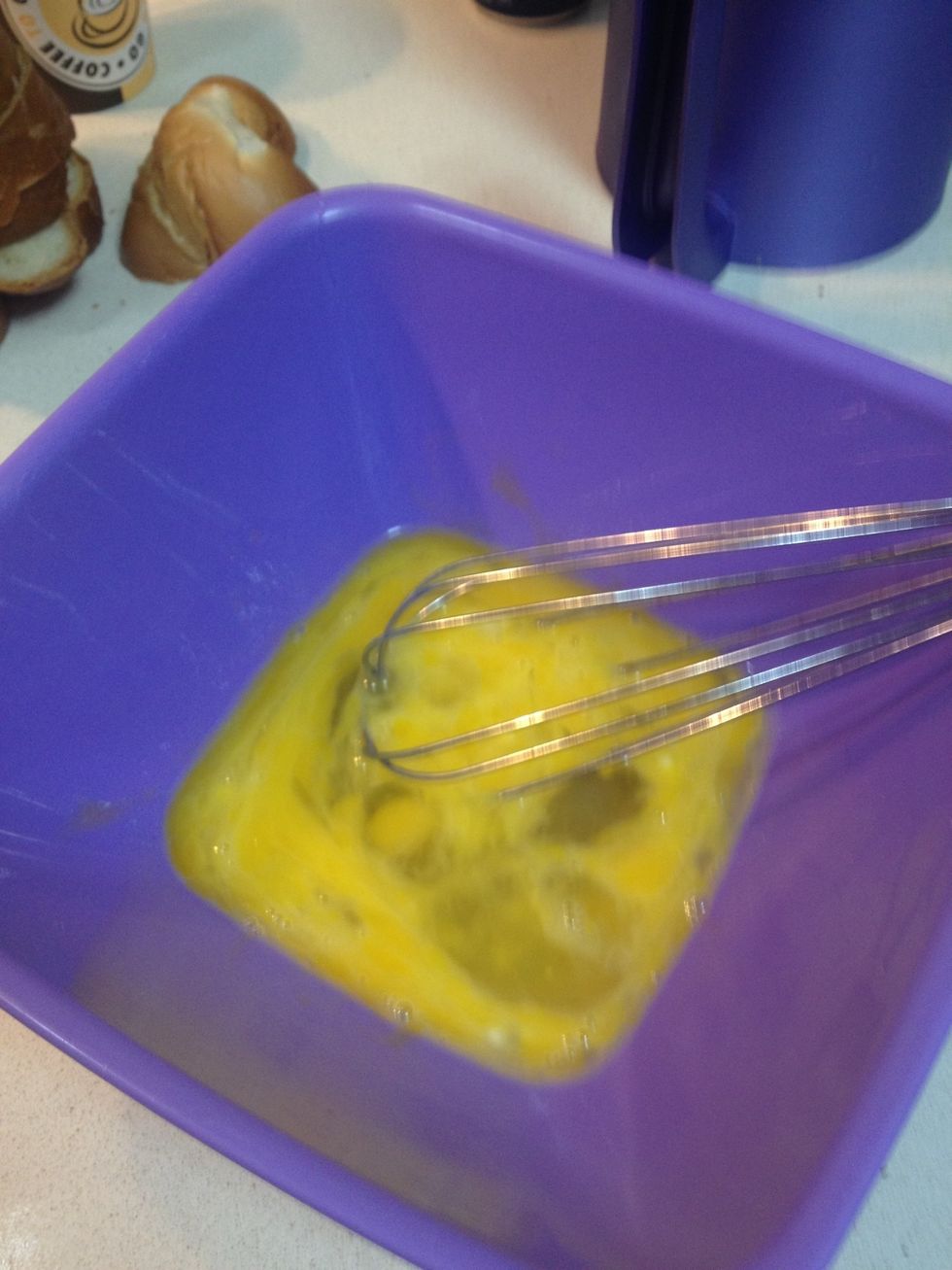 Crack 3 eggs into a bowl and stir well