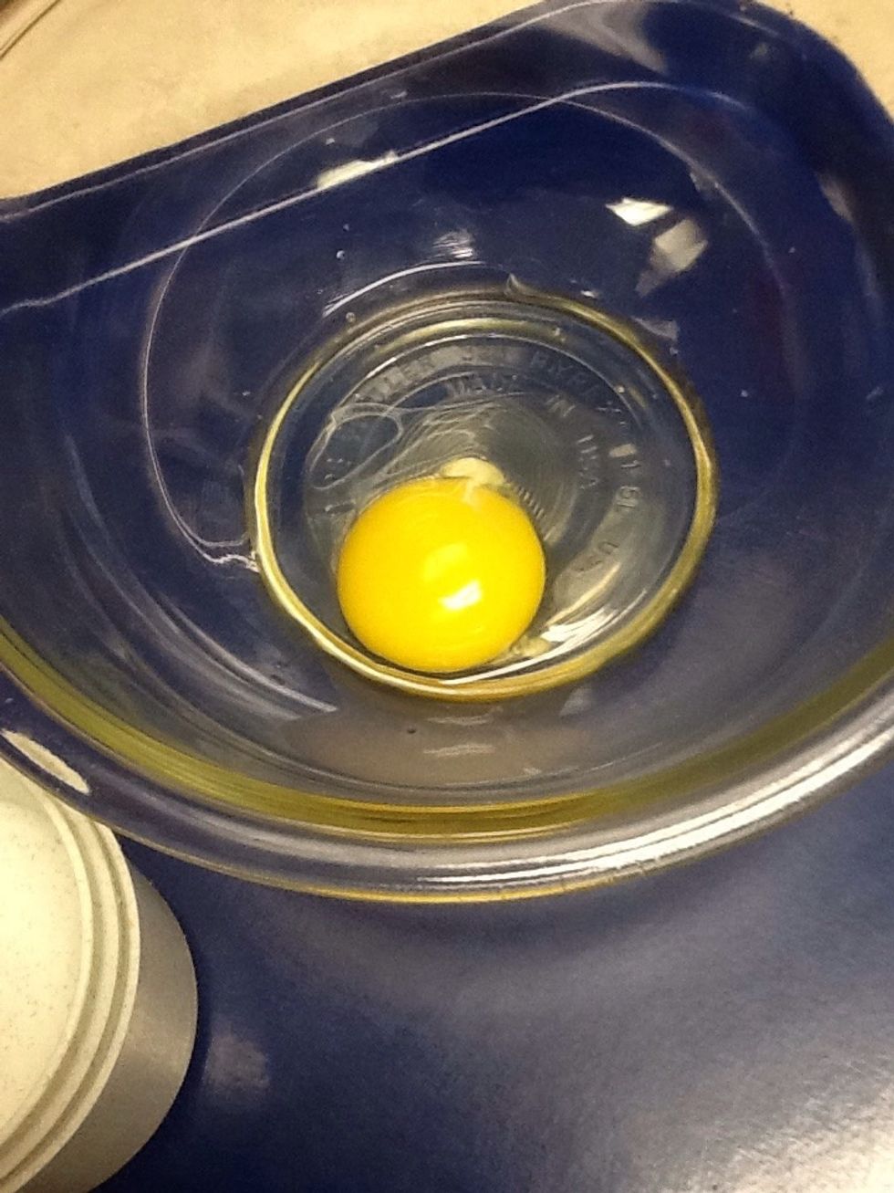 Crack a egg into a bowl and mix