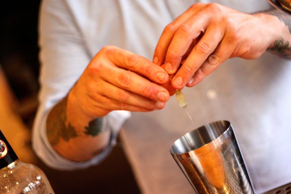 Crack a whole egg into your blender or blender cup.