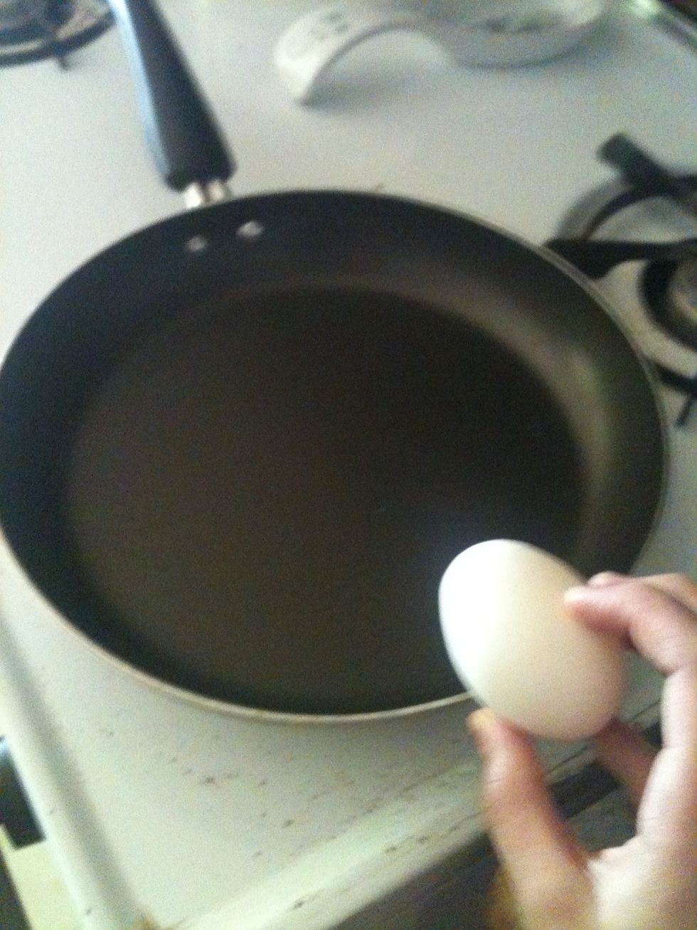 Crack all the eggs into the skillet.