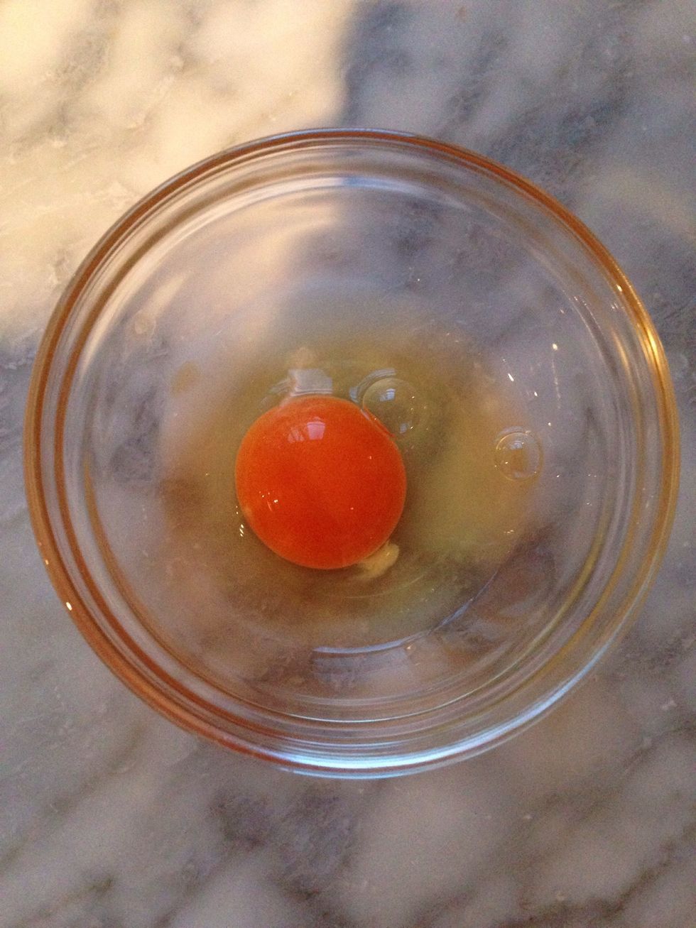 Crack an egg in the bowl