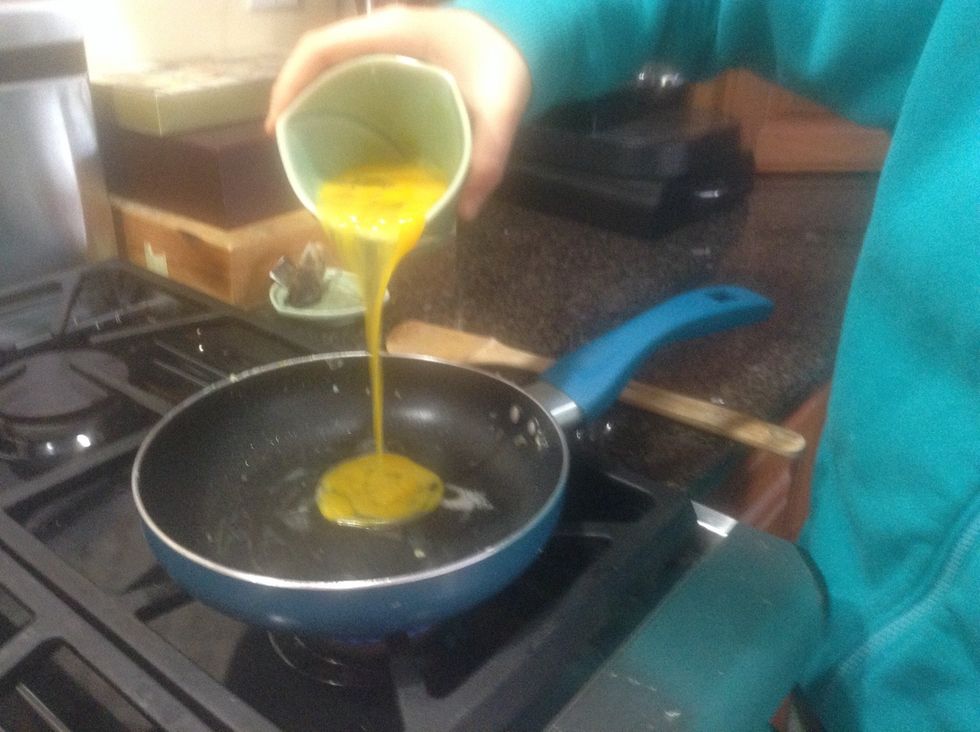 Crack and mix the eggs beforehand and after the butter has melted slowly pour in the eggs.