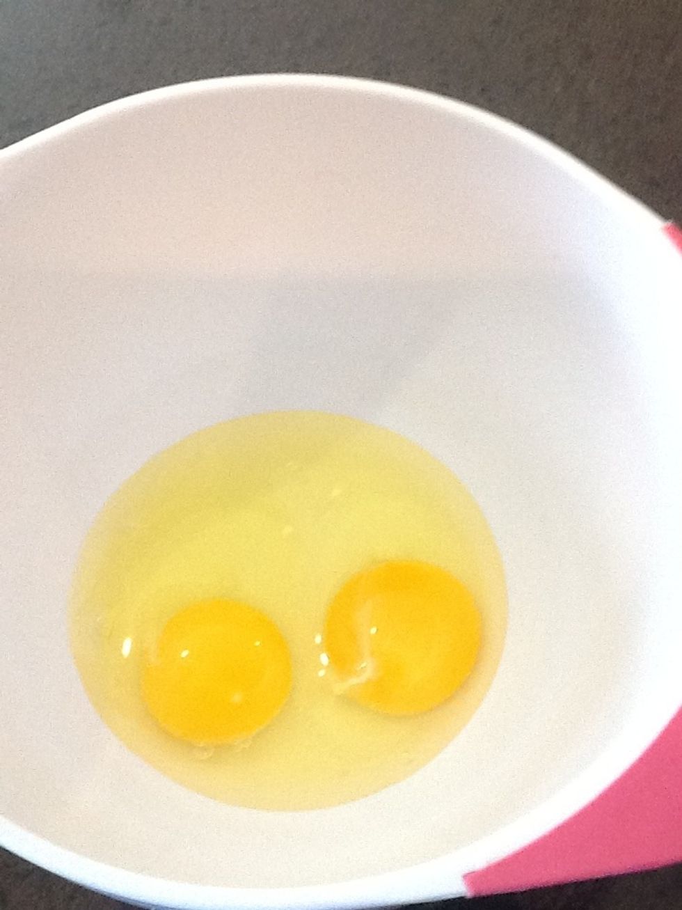 Crack both eggs into a bowl