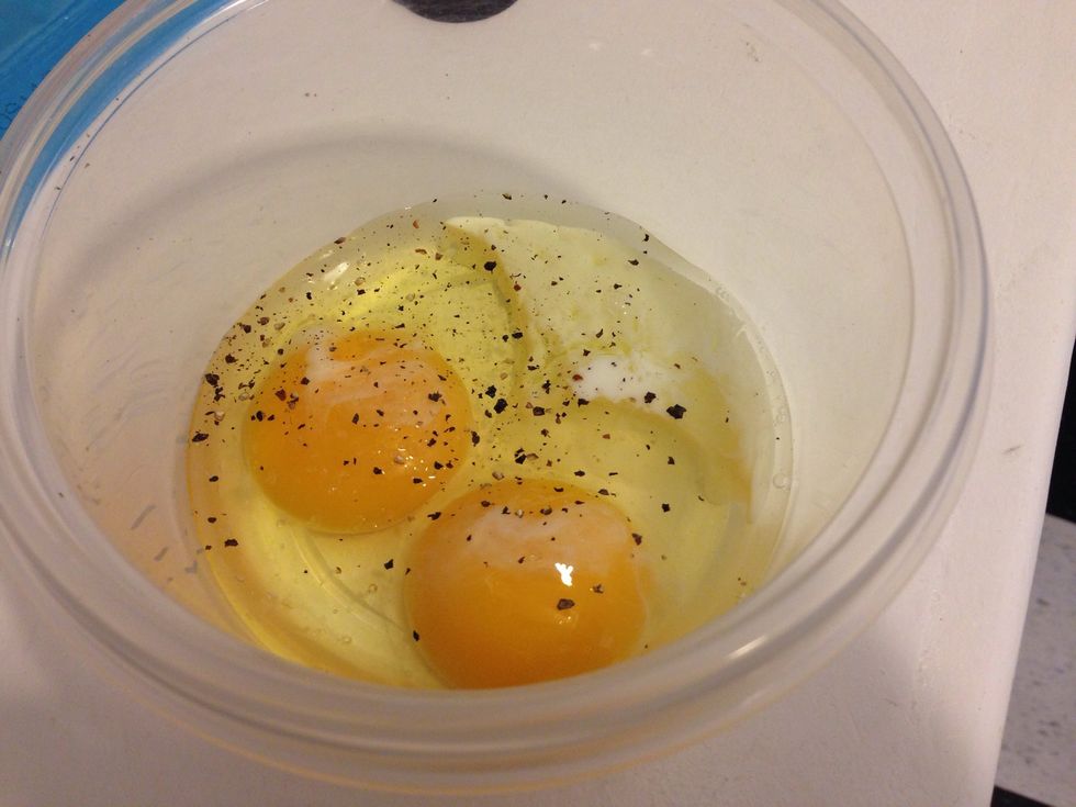 Crack eggs and add to bowl. Then add milk salt and pepper. You can also add hot sauce here if you like.