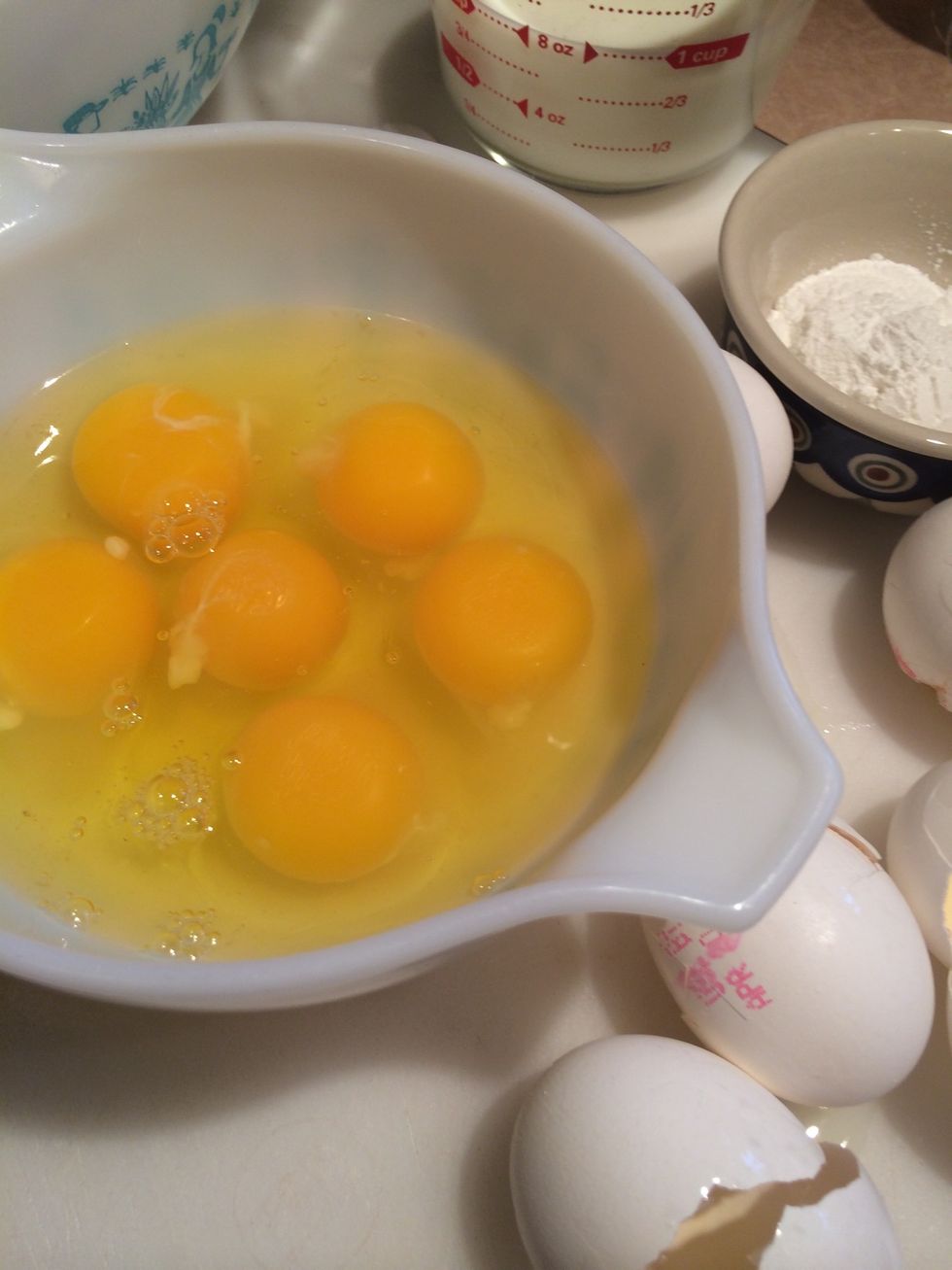 Crack eggs in a separate bowl.