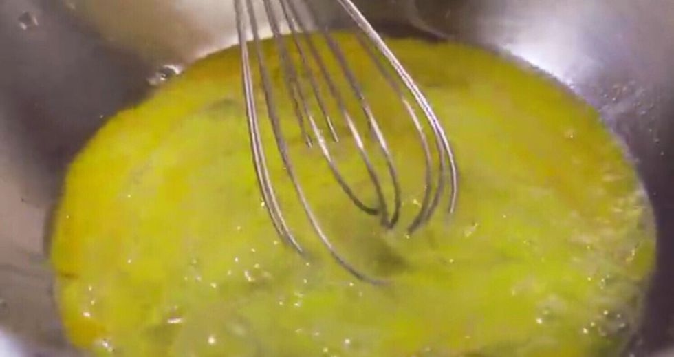 Crack eggs into a mixing bowl and beat until creamy. Add in all dry ingrediants, including baking soda if using self-raising flour. Do not stir mixture at this point.