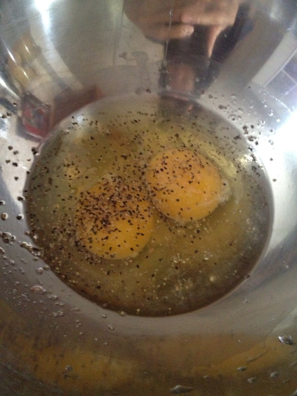 Crack eggs into big bowl, add salt and ground black pepper to taste. Beat eggs up with hand mixer with wire attachement until well mixed.