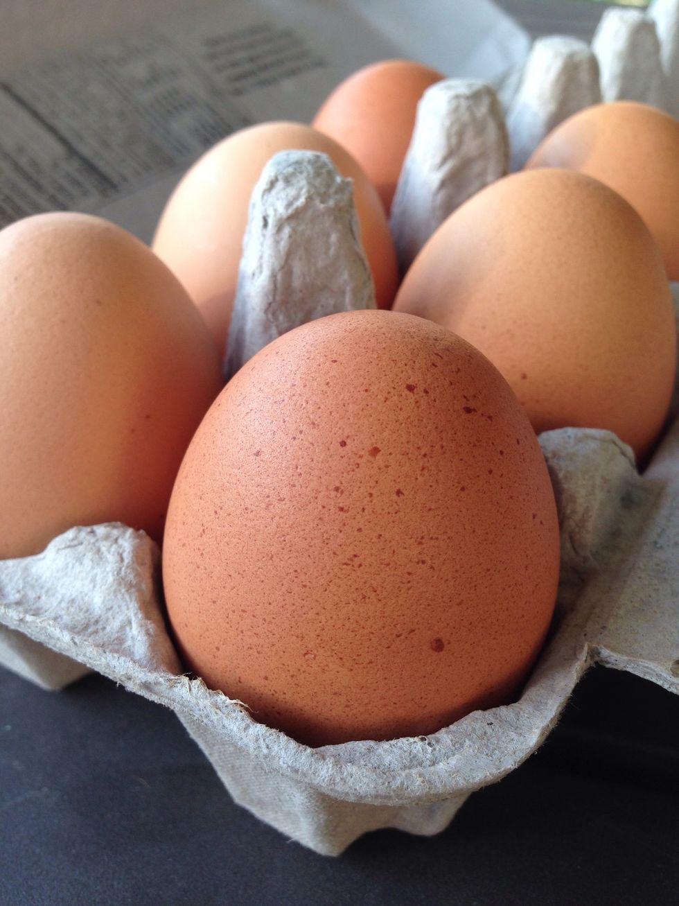 Crack four eggs on top of the chocolate. Make sure they're room temperature.