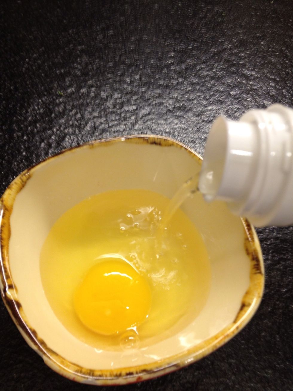 Crack it to a small container and add a little bit of vinegar (destilled or other type if you want to). Three spoons of it should be enough