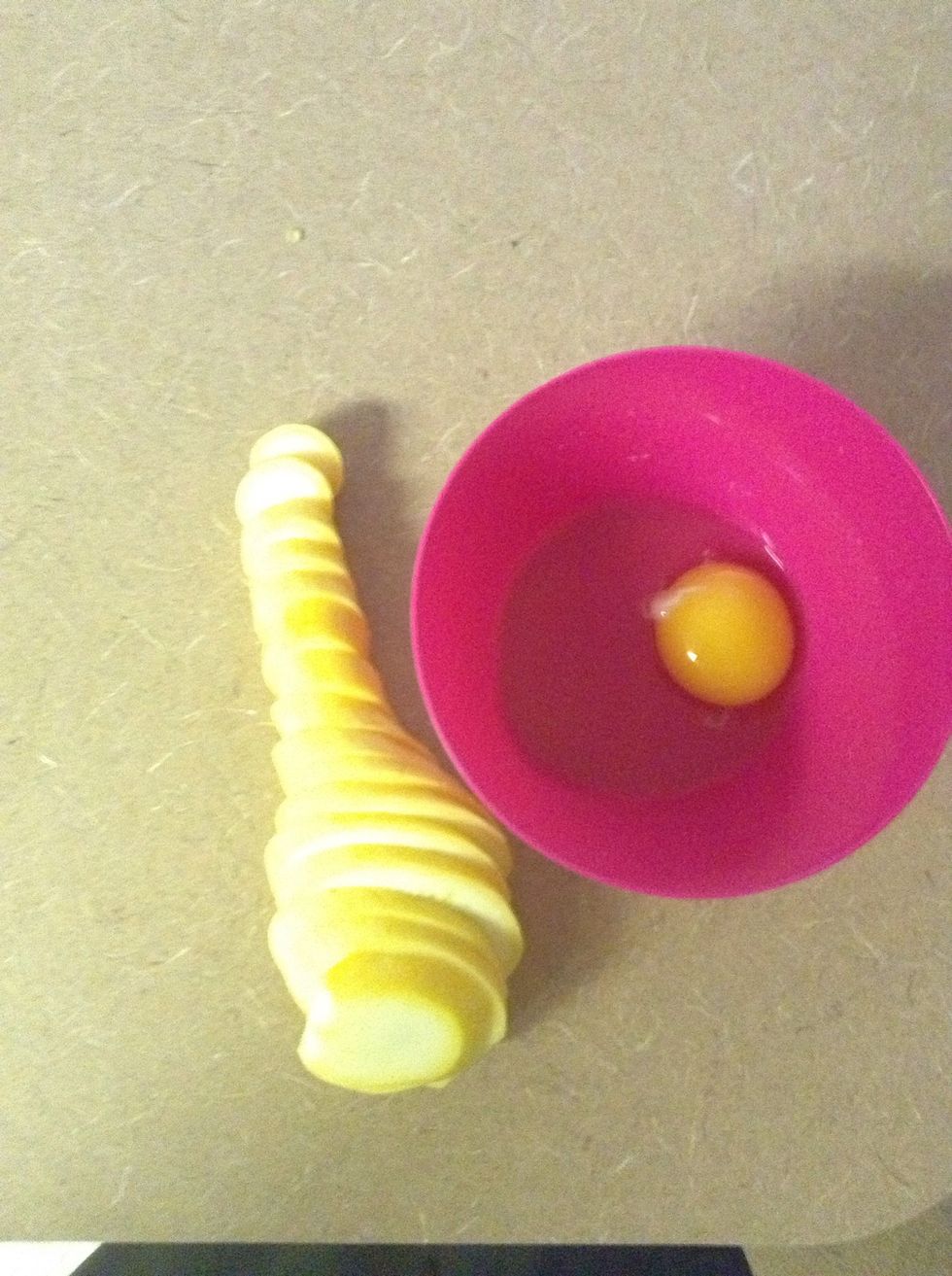 Crack the egg. Add 3 teaspoons flour if you do have it, if not, its ok