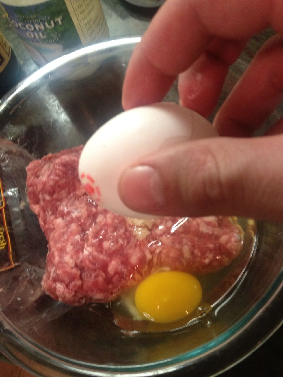 Crack the egg and add it to the mix.