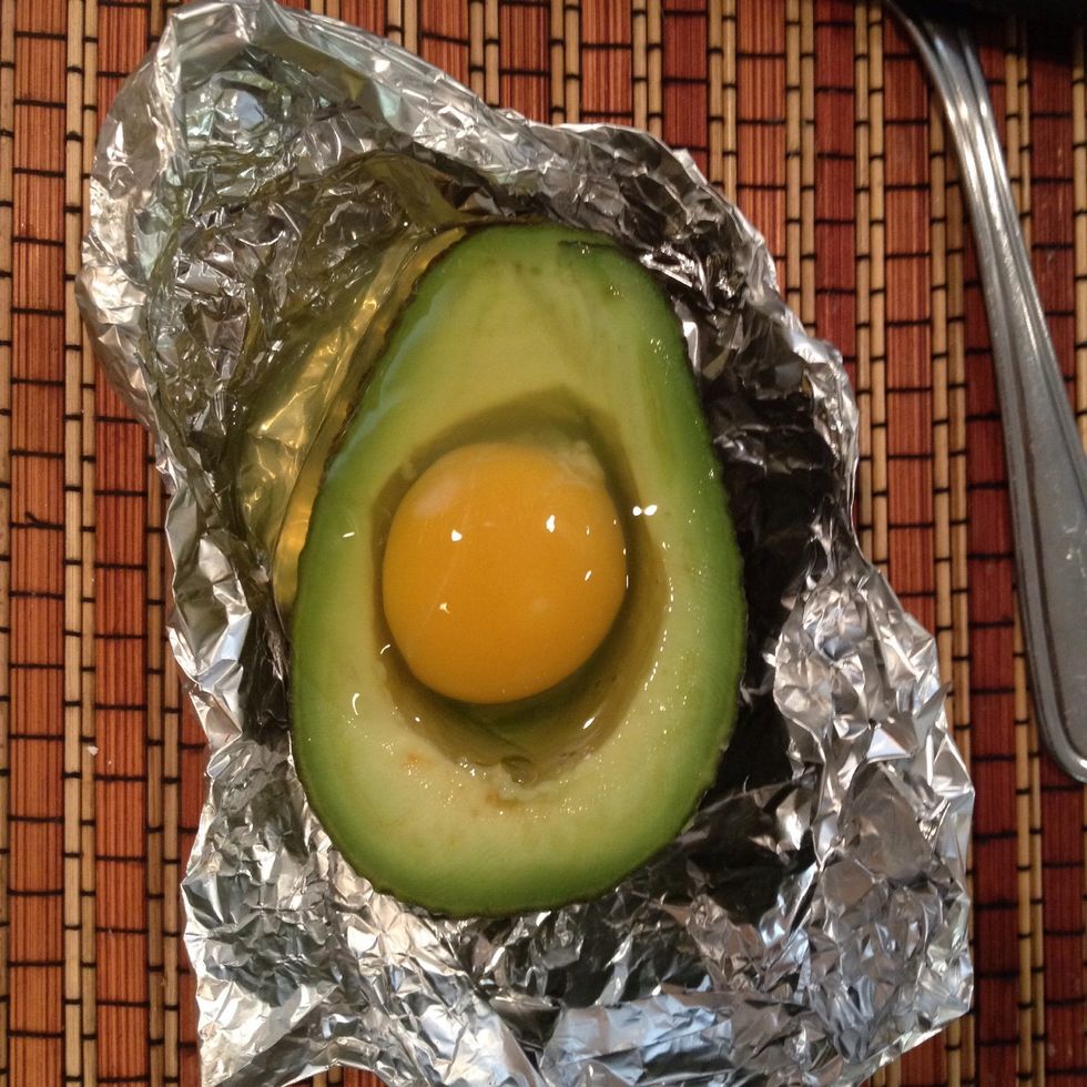 Crack the egg inside..it's okay if it spills out. That's what the foil bowl is for ;)