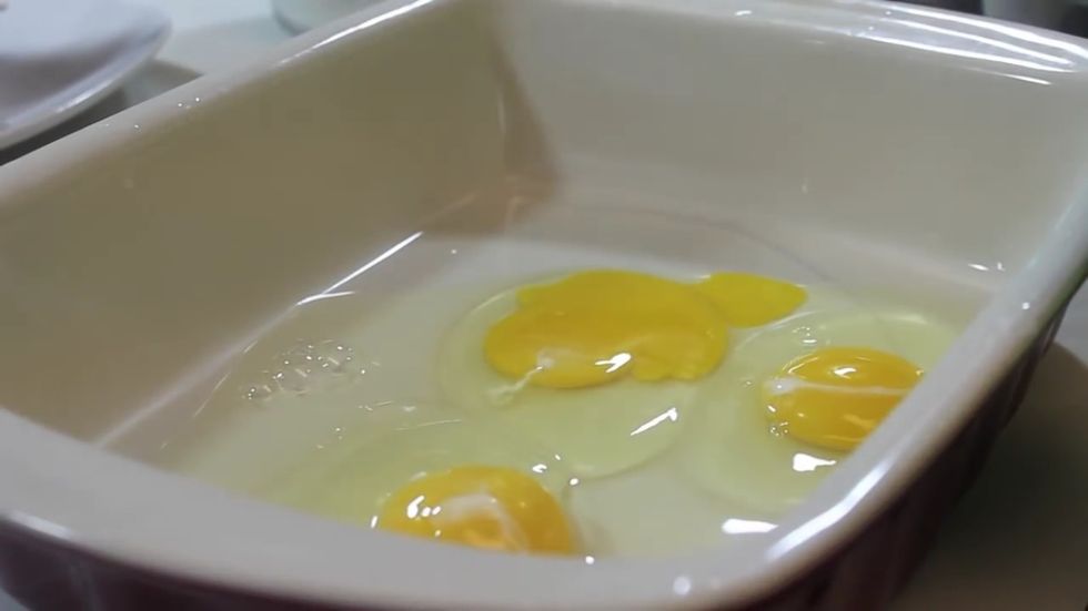 Crack the eggs (3) into a bowl