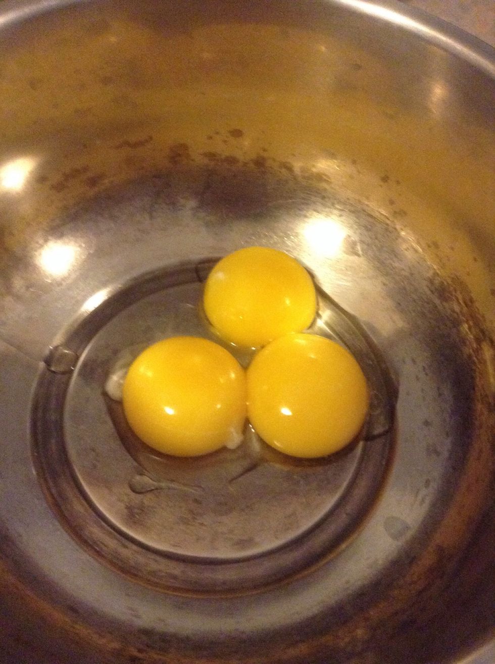 Crack the eggs and separate the yolk and the white. We don't need the whites so just put them away.