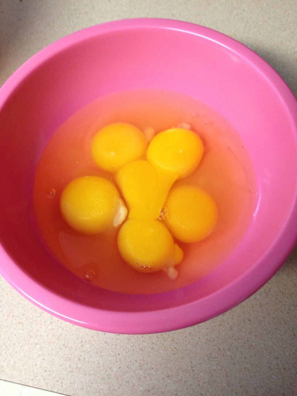 Crack the three whole eggs plus three egg yolks into a bowl and whisk to combine