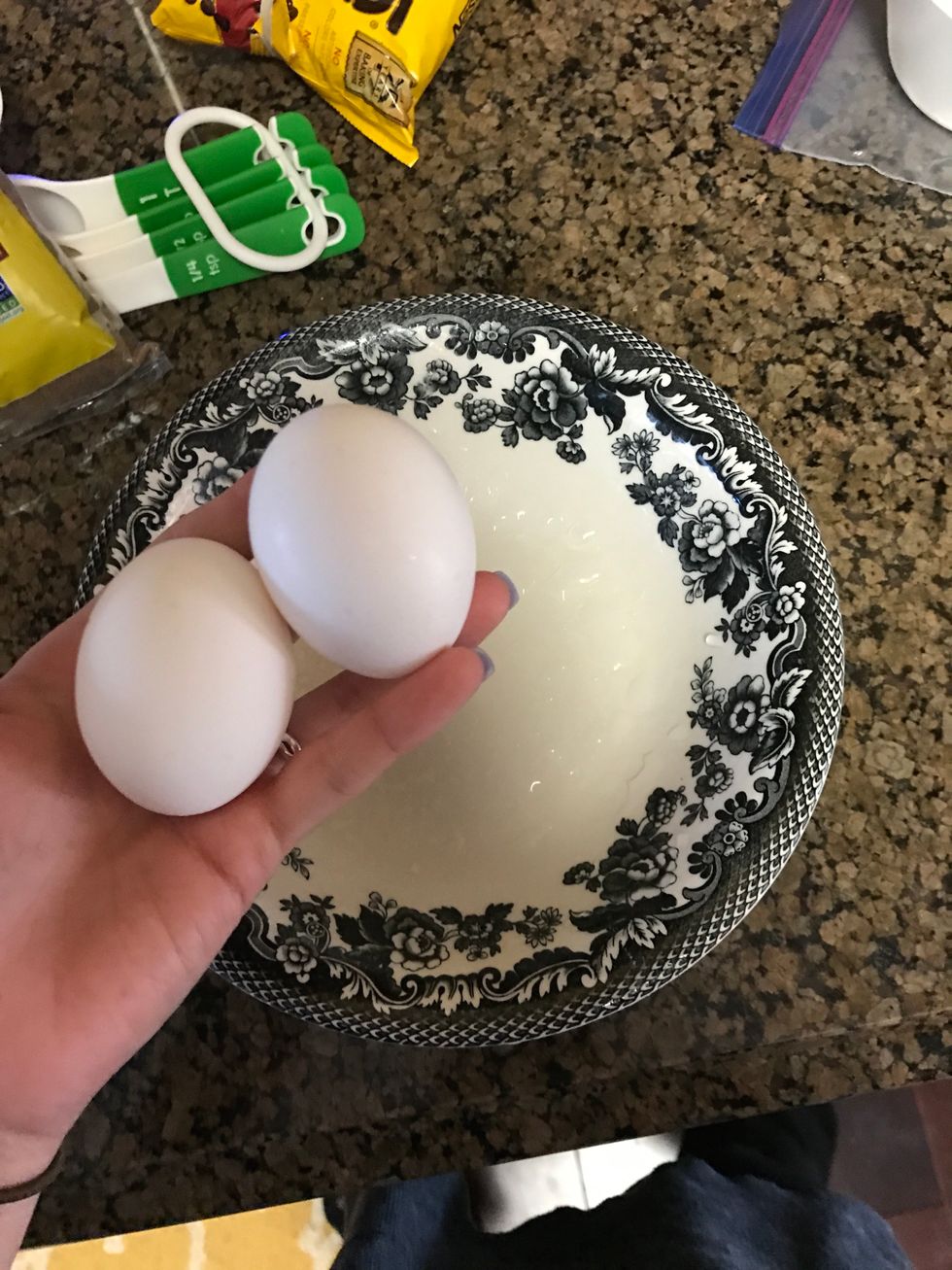 Crack the two eggs into a separate bowl