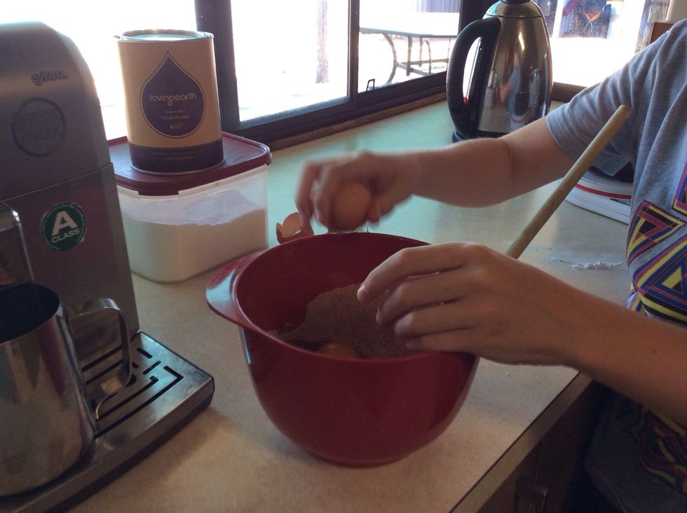 Crack two eggs and pour them into the bowl.
