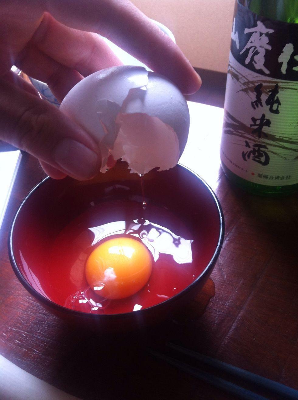 Crack your egg into your smaller of your two bowls. One handed if you're trying to look like a top chef.