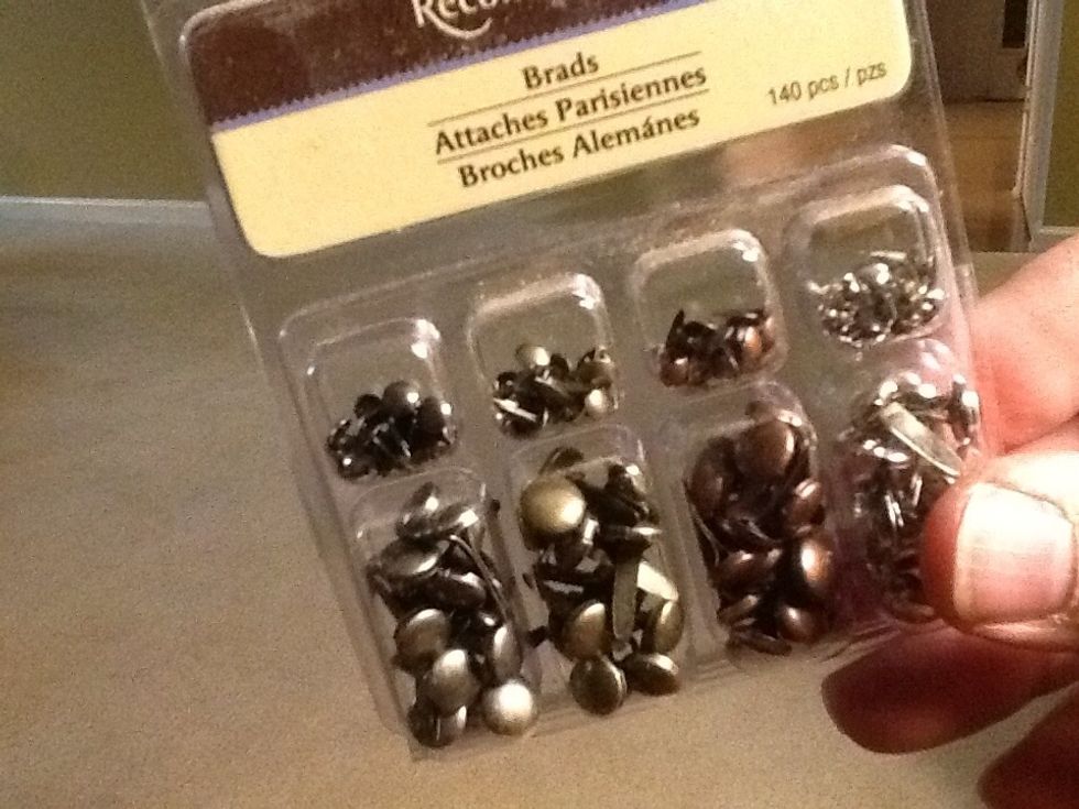 Craft store brads notice different shades of chrome, copper and bronze.