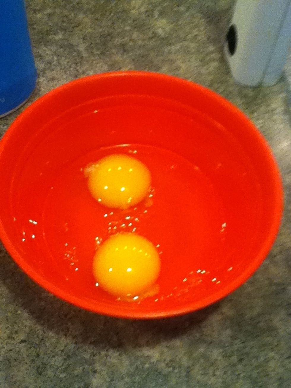 Crake eggs into bowl